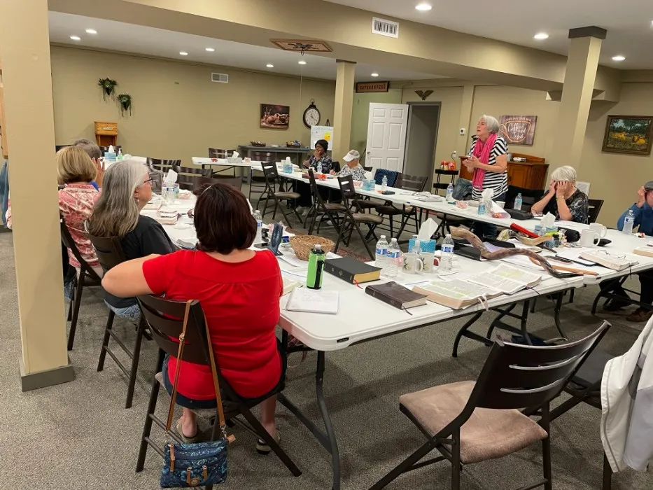 A Tuesday Bible class gathered around tables at The Ingathering