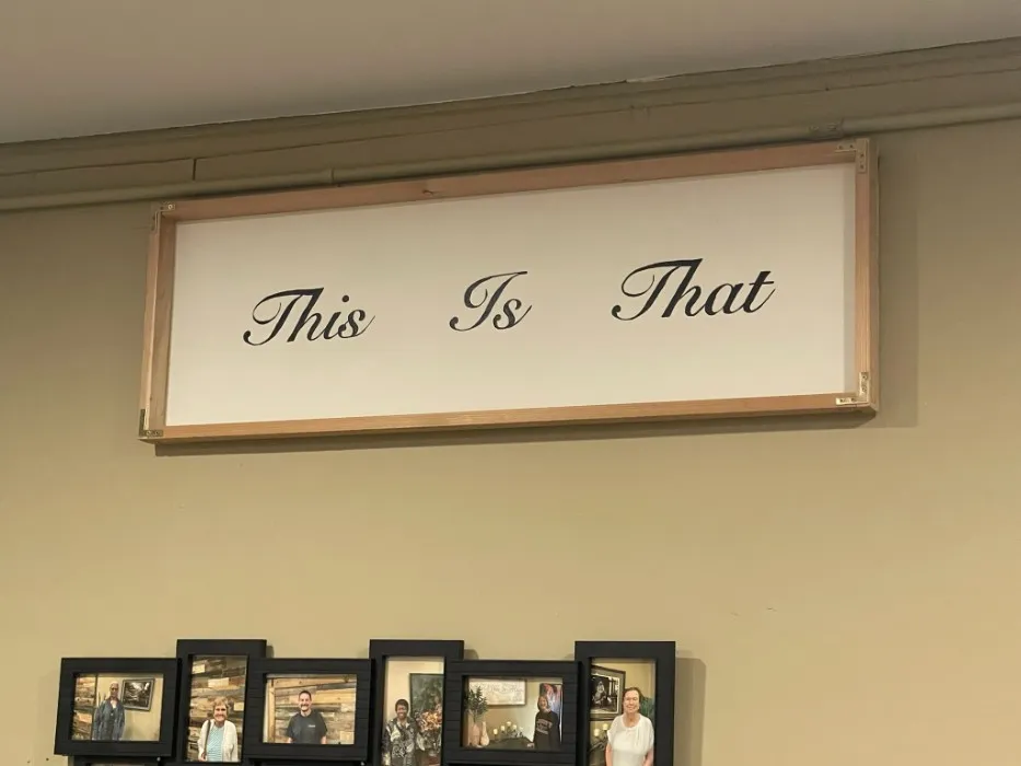 “This Is That” sign on the wall of the gathering room